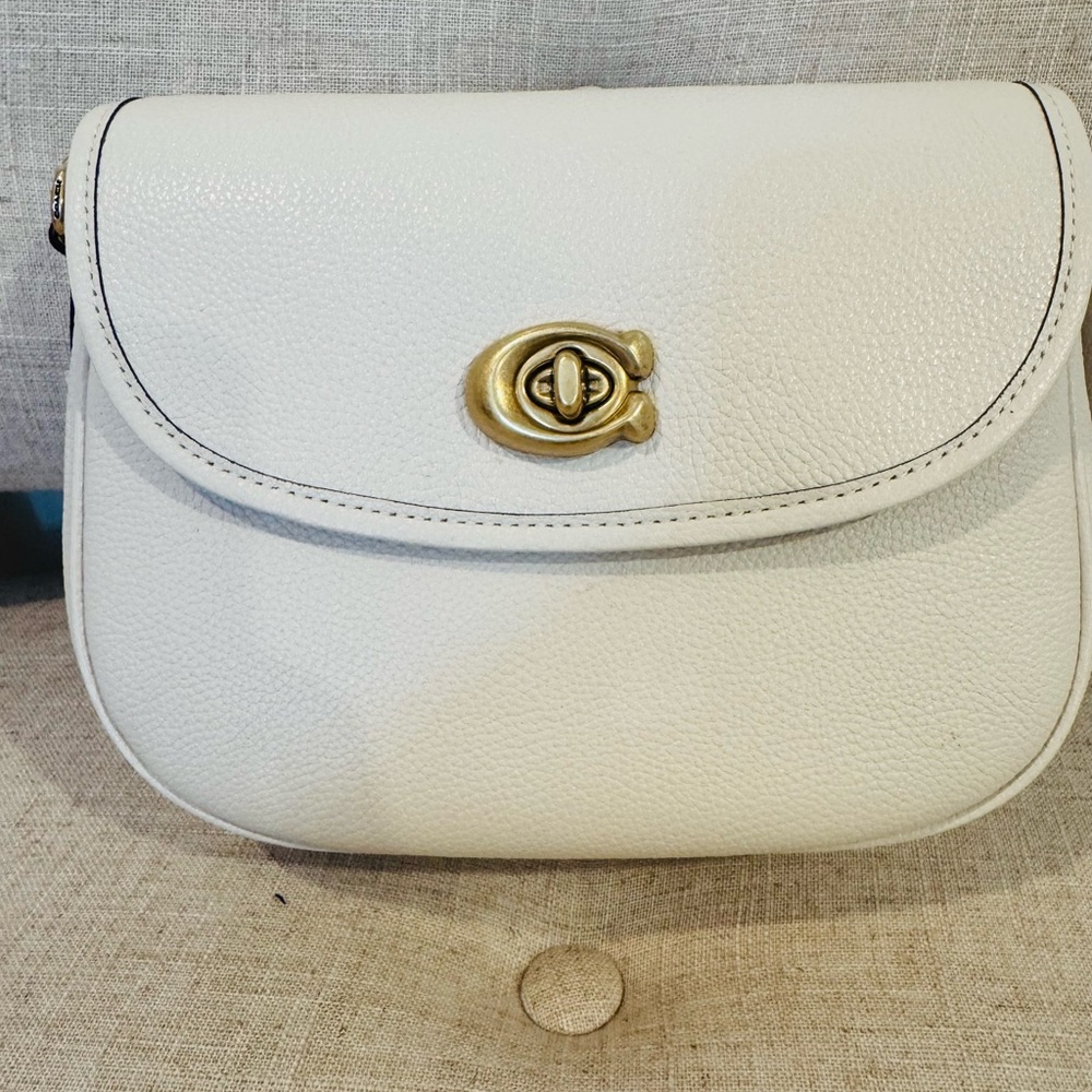 * Coach "Willow" crossbody bag in polished pebble leather in the color beige